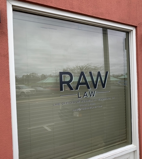 The window sign of The Law Office of Russell A. Woodard, Jr., LLC in Ruston, LA